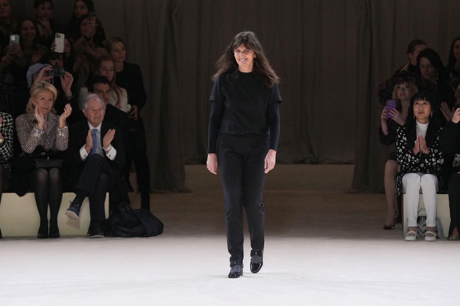 PARIS, FRANCE - JANUARY 23: (EDITORIAL USE ONLY - For Non-Editorial use please seek approval from Fashion House) Designer Virginie Viard acknowledges the applause of the public after the Chanel Haute Couture Spring/Summer 2024 show as part of Paris Fashion Week on January 23, 2024 in Paris, France. (Photo by Francois Durand/Getty Images)