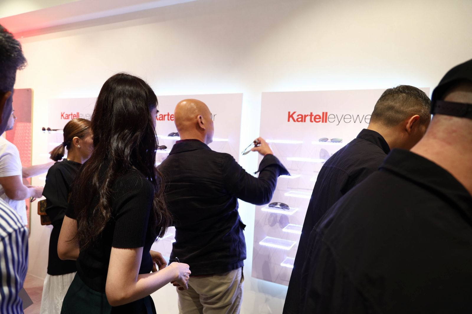 Guests grab their exclusive Kartell Eyewear giveaways at the event (Photo: Courtesy of Kuysen)