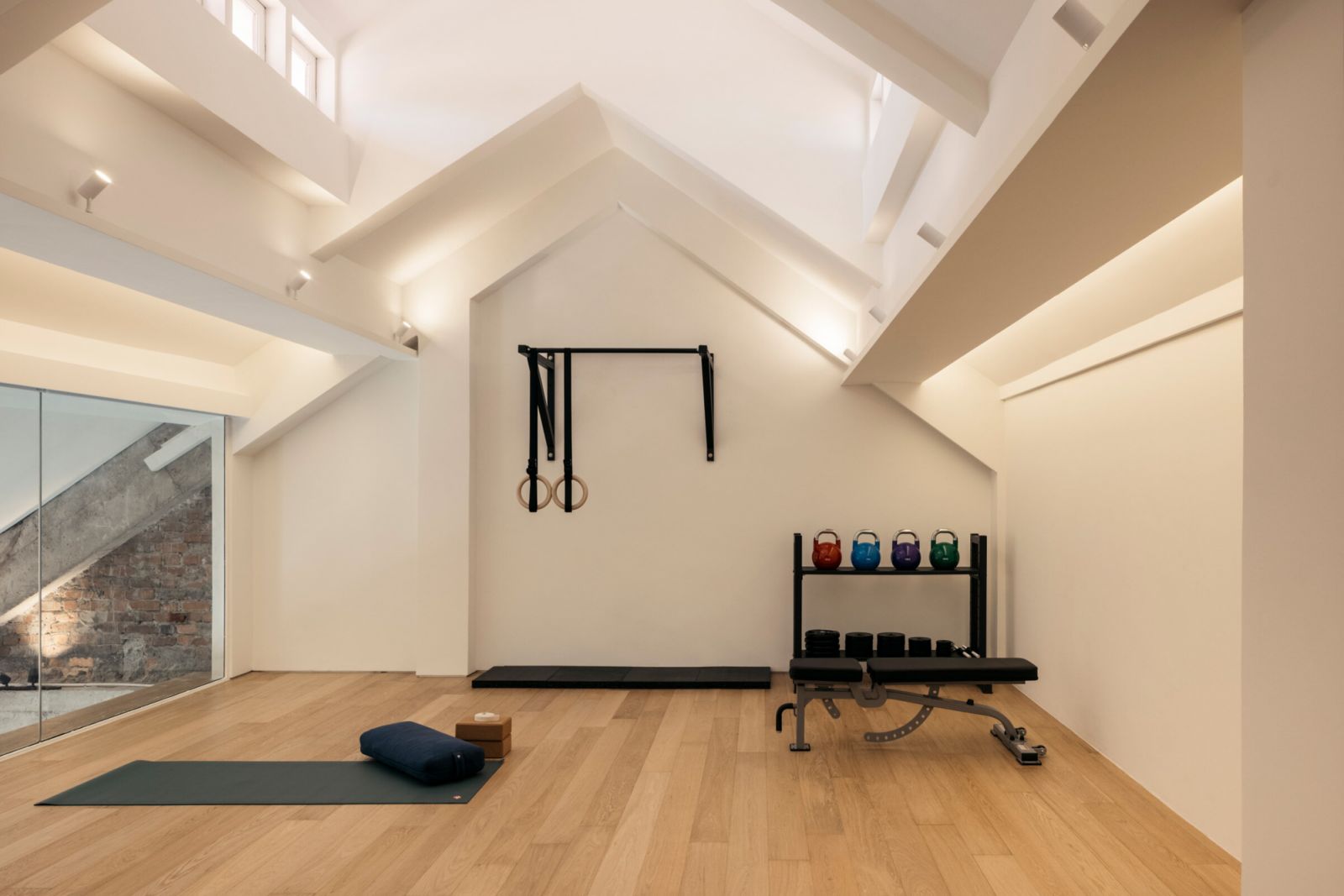 The gorgeous fitness space at Trapeze Rec Club, complete with a vaulted ceiling (Photo: Studio Periphery)