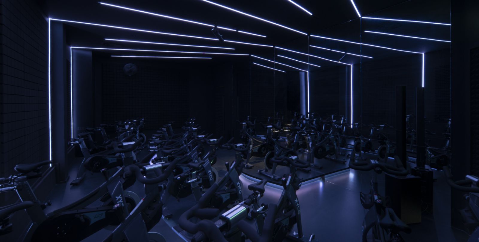 A dark and intriguing ambience sets the stage a perfectly pumped-up indoor cycling session at Xyco Studio (Photo: Form Practice)