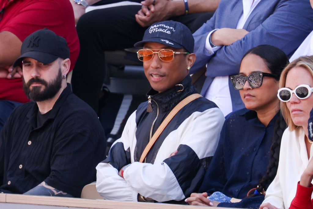 PARIS, FRANCE - JUNE 09: Pharrell Williams and Helen Lasichanh attends the 2024 French Open at Roland Garros on June 09, 2024 in Paris, France. (Photo by Pierre Suu/WireImage)