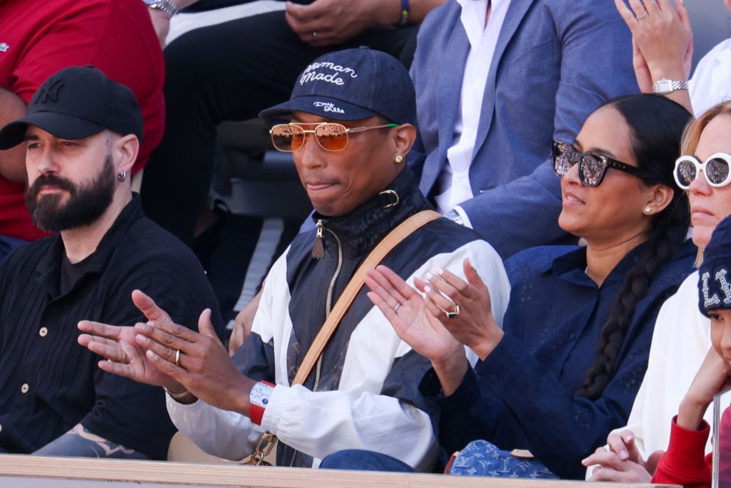 PARIS, FRANCE - JUNE 09: Pharrell Williams and Helen Lasichanh attends the 2024 French Open at Roland Garros on June 09, 2024 in Paris, France. (Photo by Pierre Suu/WireImage)