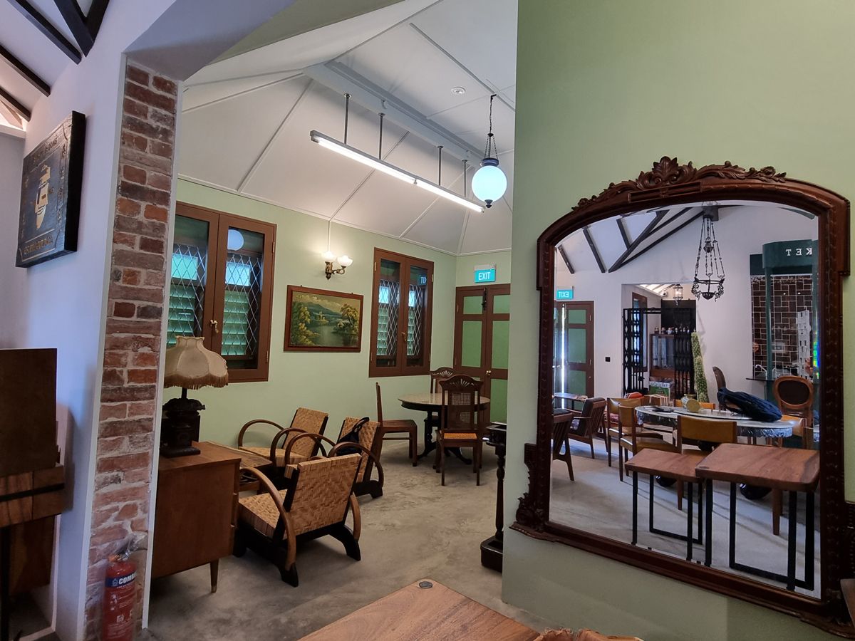 The interior of the restored Staff Quarters transformed into a café with furnishings reminiscent of time passed