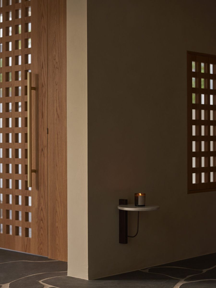 The entryway to the House of Parts, with wood panelling arranged in a gridlike manner enables entry of light to naturally light up the space while keeping it cosy (Photo: Jovian Lim)