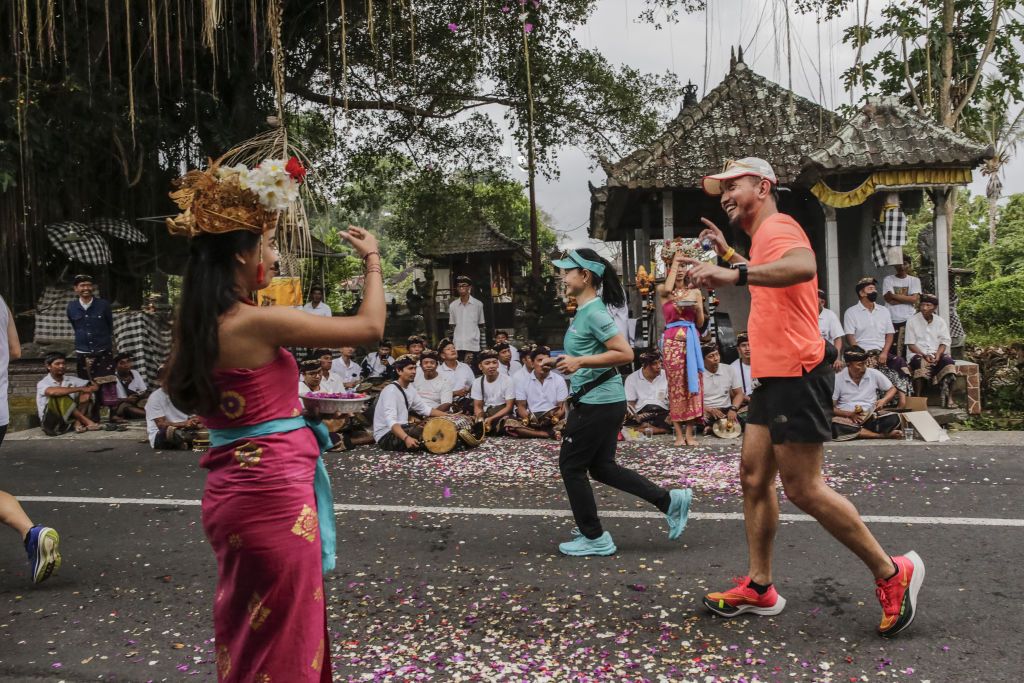 BALI, INDONESIA - AUGUST 28: Runners compete during Maybank Bali Marathon 2022 in Gianyar, Bali, Indonesia on August 28, 2022. At least 10,000 runners from several nations participated in this World Athletic elite road race certified. The race being held for the first time as Covid-19 pandemic subside in Indonesia and also as part of to boost tourism economic industry in the resort island of Bali. (Photo by Johannes P. Christo/Anadolu Agency via Getty Images)