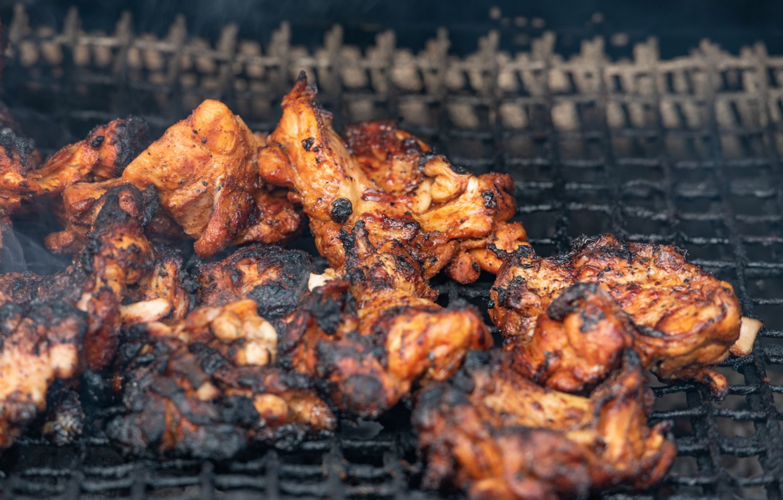 Jerk chicken on the grill (Photo: Getty Images)
