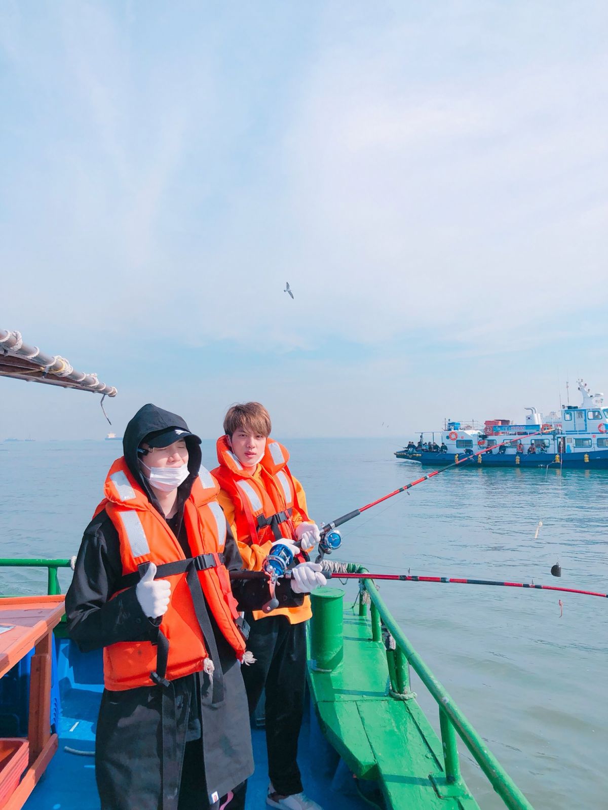 Jin and Suga fishing (image courtesy of X / @bts_bighit)