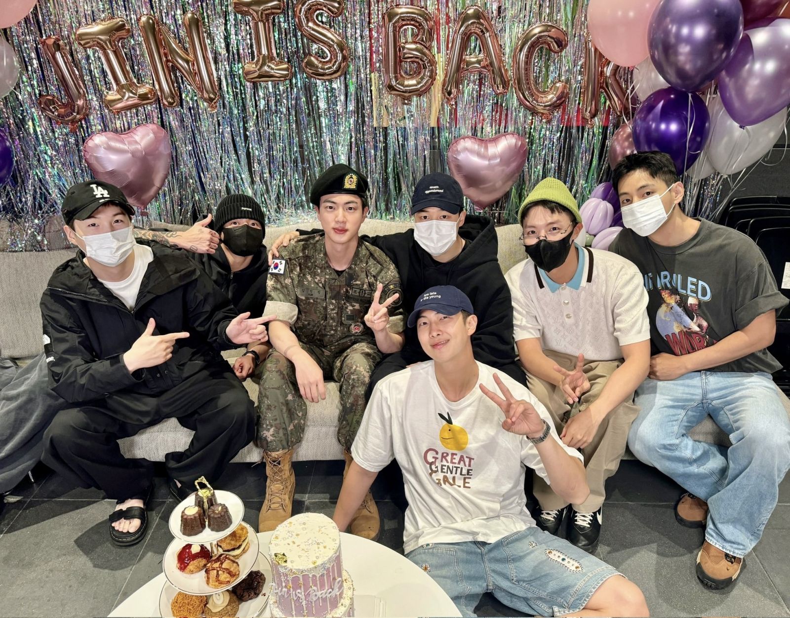 The members celebrating Jin's military discharge (image courtesy of X / @bts_bighit)