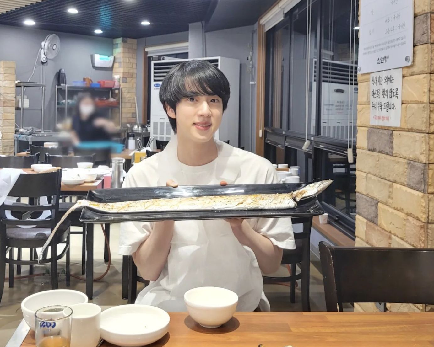 Jin eating fish for dinner (image courtesy of Instagram / @jin)