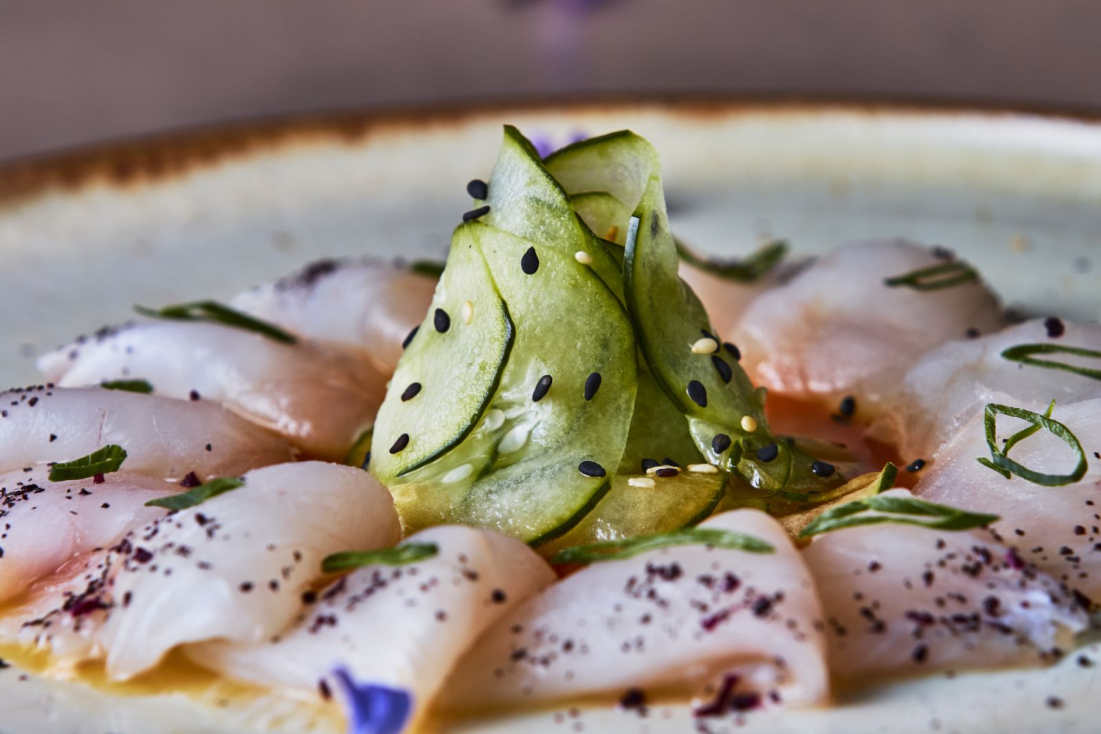 Whitefish tiradito on a bed of spicy sauce (Photo: Getty Images)