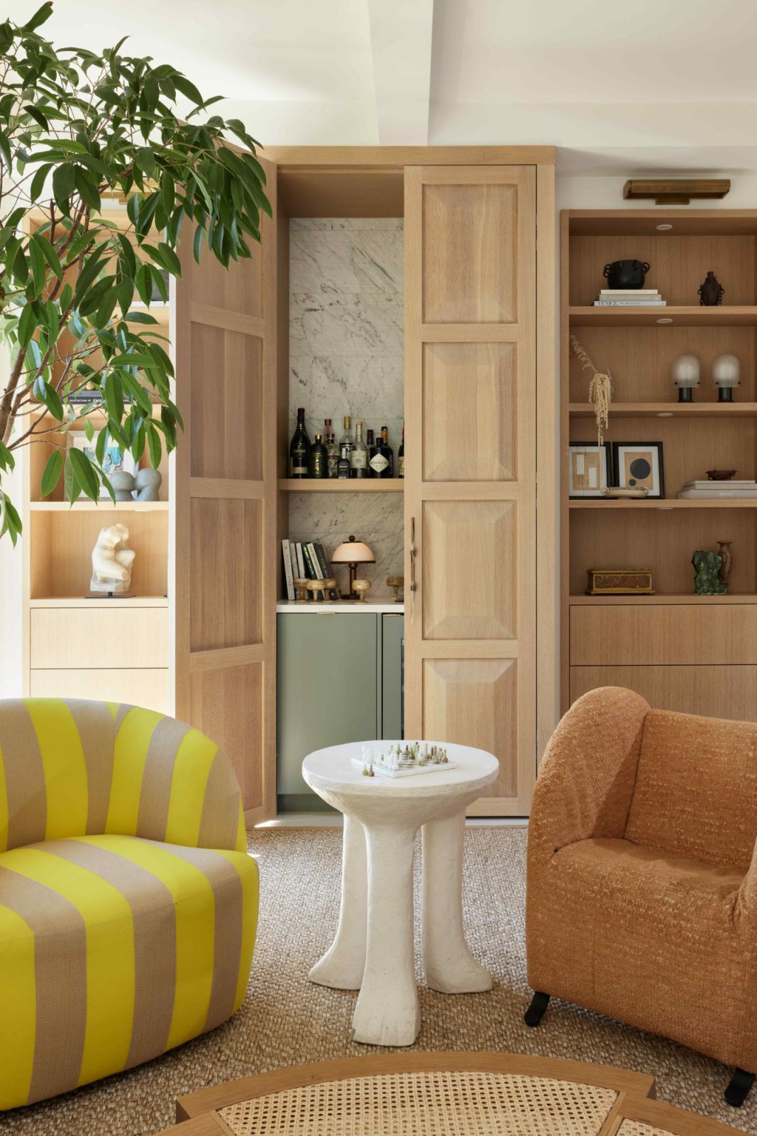 Oak millworks exude warmth and provide functional storage space