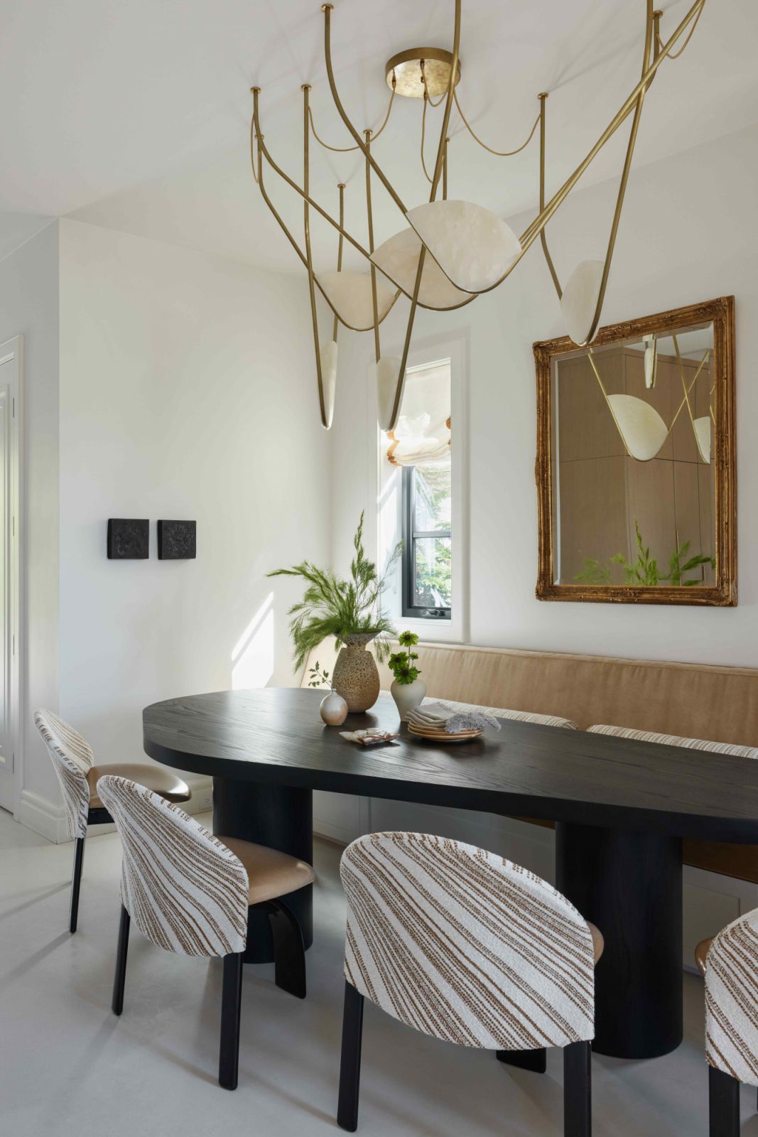 Local light maker Randy Zieber's pendant draws attention in the dining room