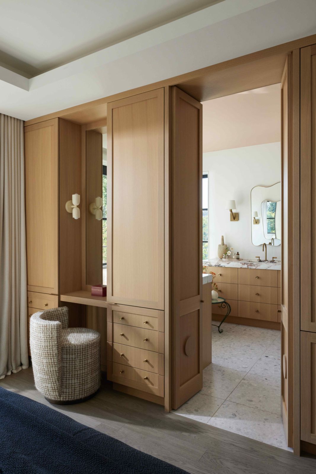 Warm oak leads into the primary bath