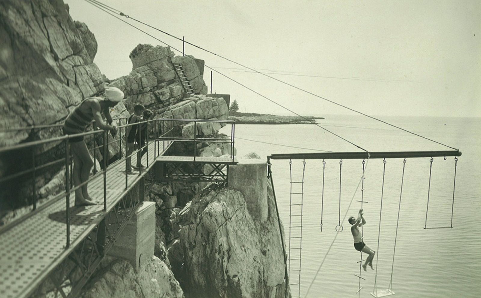 Guests using the ropes and swings by the pool in 1927