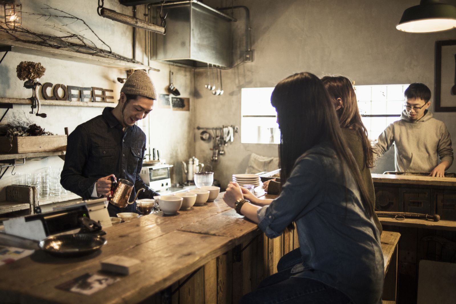 Male barista working in coffee shop