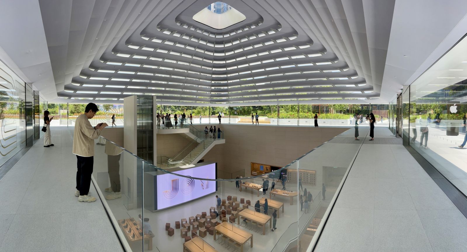 The store’s sculptural quartz and glass staircase connects three levels where customers can explore, learn and shop