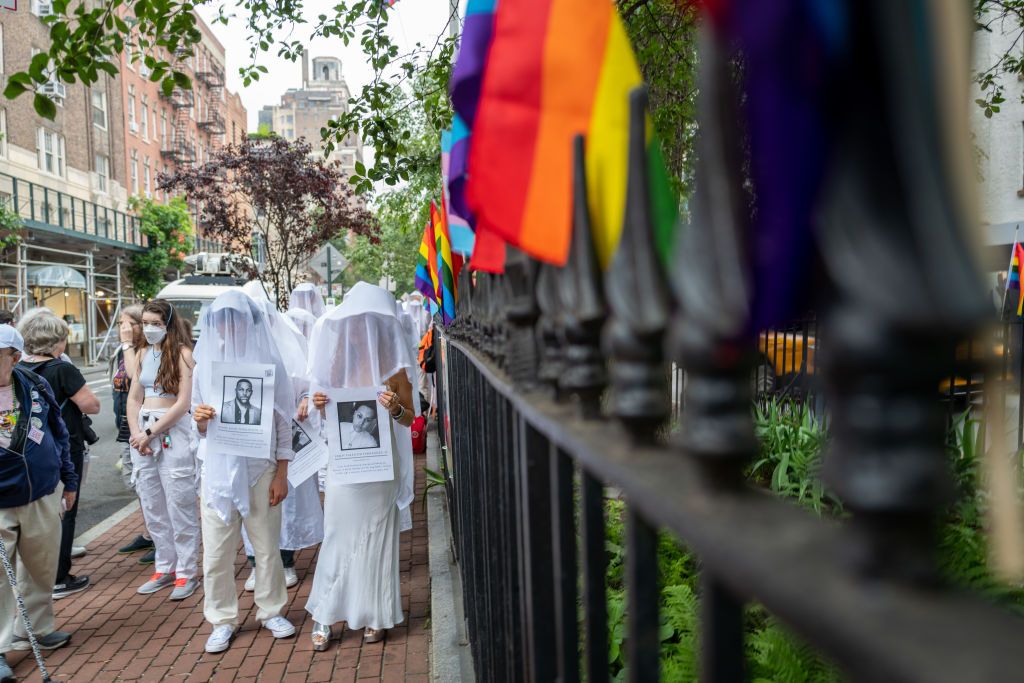 NEW YORK, NEW YORK - JUNE 12: Members of the activist group Gays Against Guns hold pictures of the deceased during a silent vigil to mark seven years since the Pulse Nightclub mass shooting, one of the worst mass shootings in American history, on June 12, 2023 in New York City. The vigil began at the Stonewall Inn, a gay bar and National Historic Landmark in Manhattan's West Village. On June 12, 2016, Omar Mateen, a 29-year-old man, killed 49 people and wounded 53 more in a mass shooting at Pulse, a gay nig