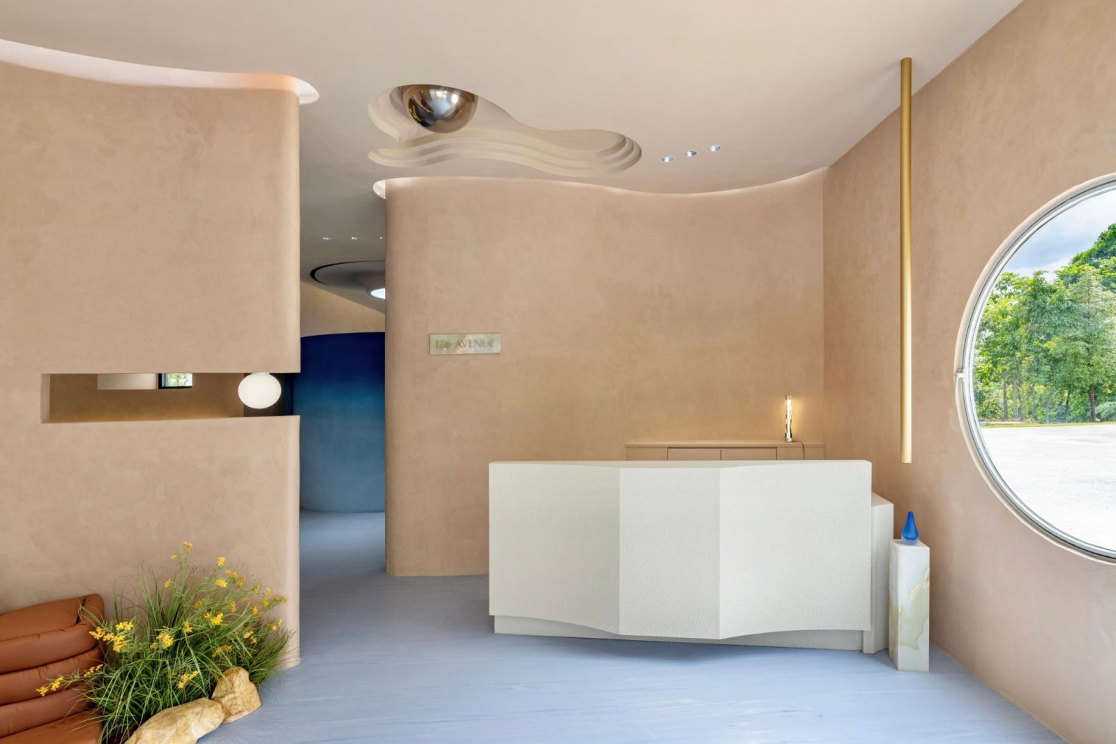 Natural light floods through a pivoting round window by the reception (Photo: Bricks Begin)