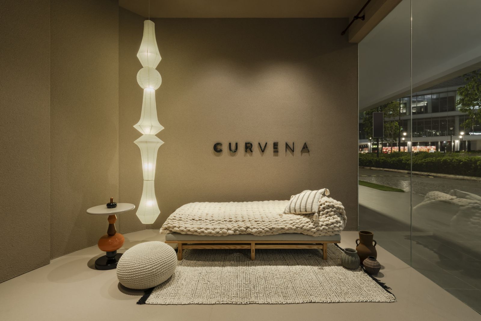 A towering lighting installation highlights a plush knitting sofa (Photo: David Yeow)