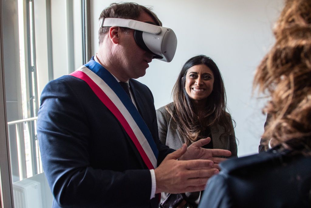 Mayor Geoffroy Boulard is observing the design of the new student residence hall with a virtual reality helmet in the 17th arrondissement of Paris, France, on April 29, 2024. The residence hall will accommodate the staff of the Paris 2024 Olympics. (Photo by Andrea Savorani Neri/NurPhoto via Getty Images)