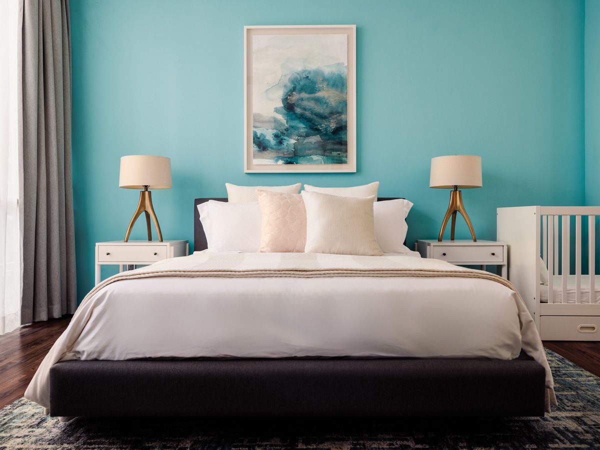 This turquoise blue wall makes the nursery pop (Photo: Designworx Interior Consultant)