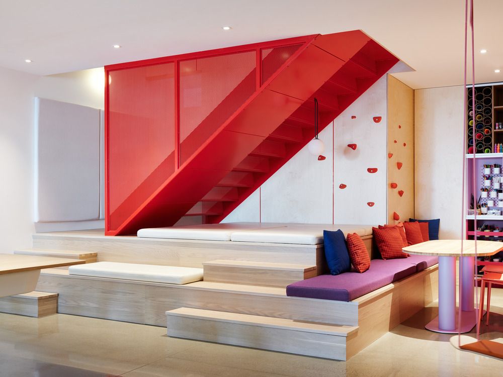 The colourful playroom with a climbing wall
