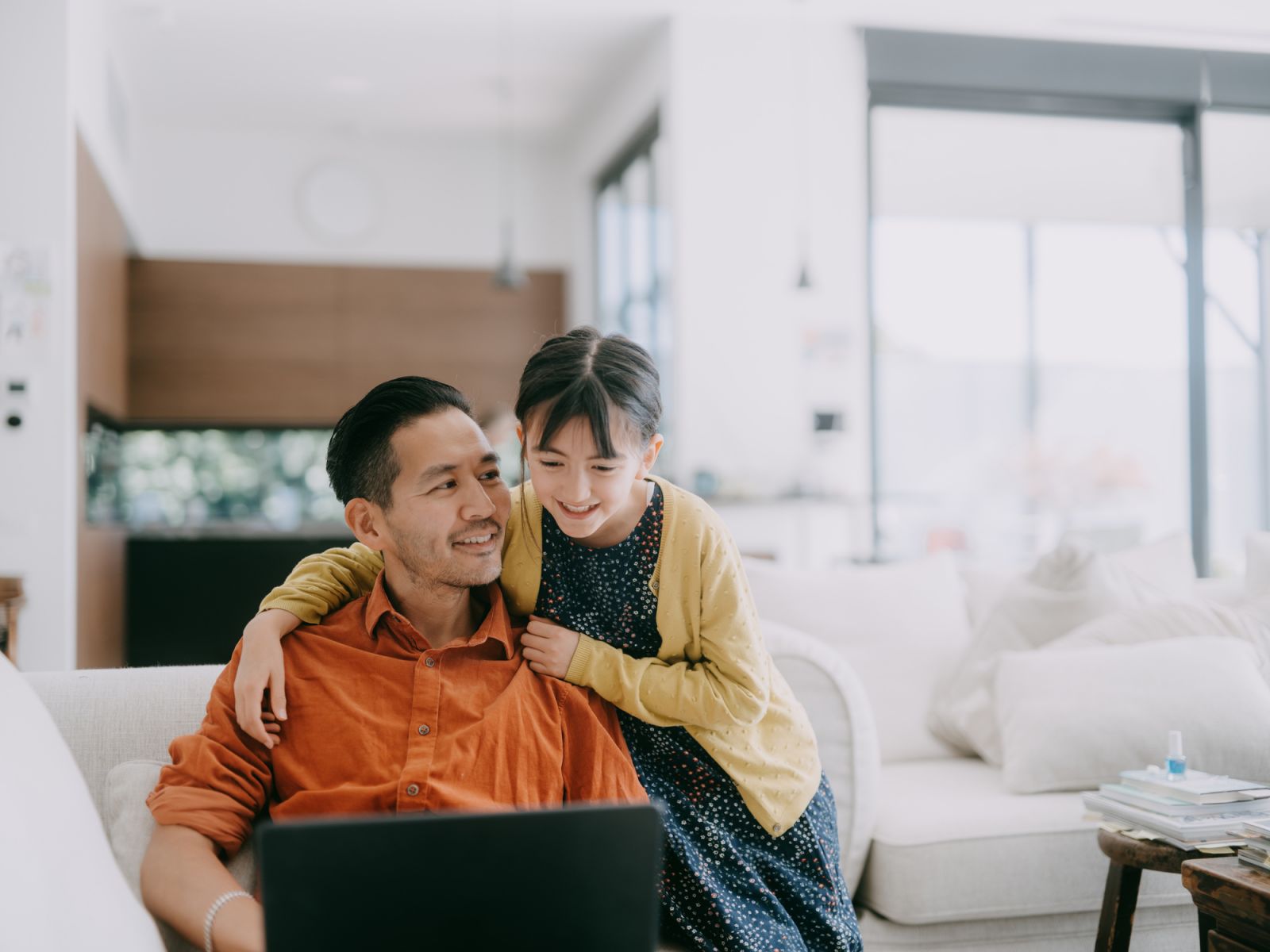 Man working at home with his daughter, Melbourne, Australia