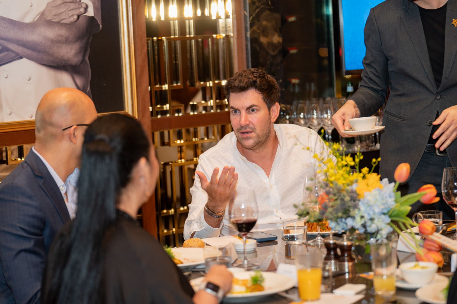 Tatler Asia chairman and CEO Michel Lamunière speaking with a guest during the event (Photo: Precieux Productions)