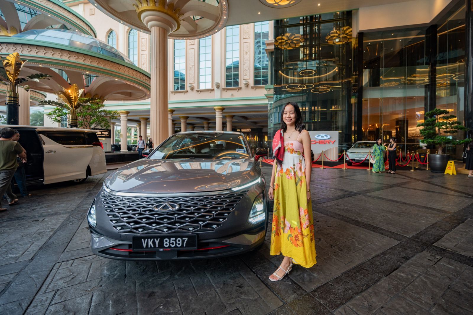 Erica Eng posing with the Chery vehicle she arrived in (Photo: Precieux Productions)