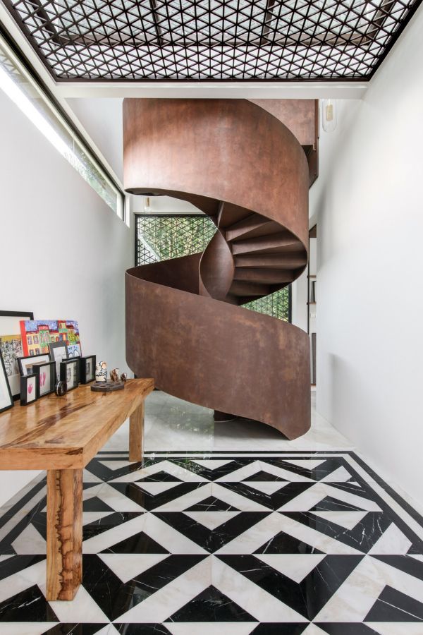 Sculptural and sinuous, the spiral staircase is a key architectural feature (Photo: David Yeow)