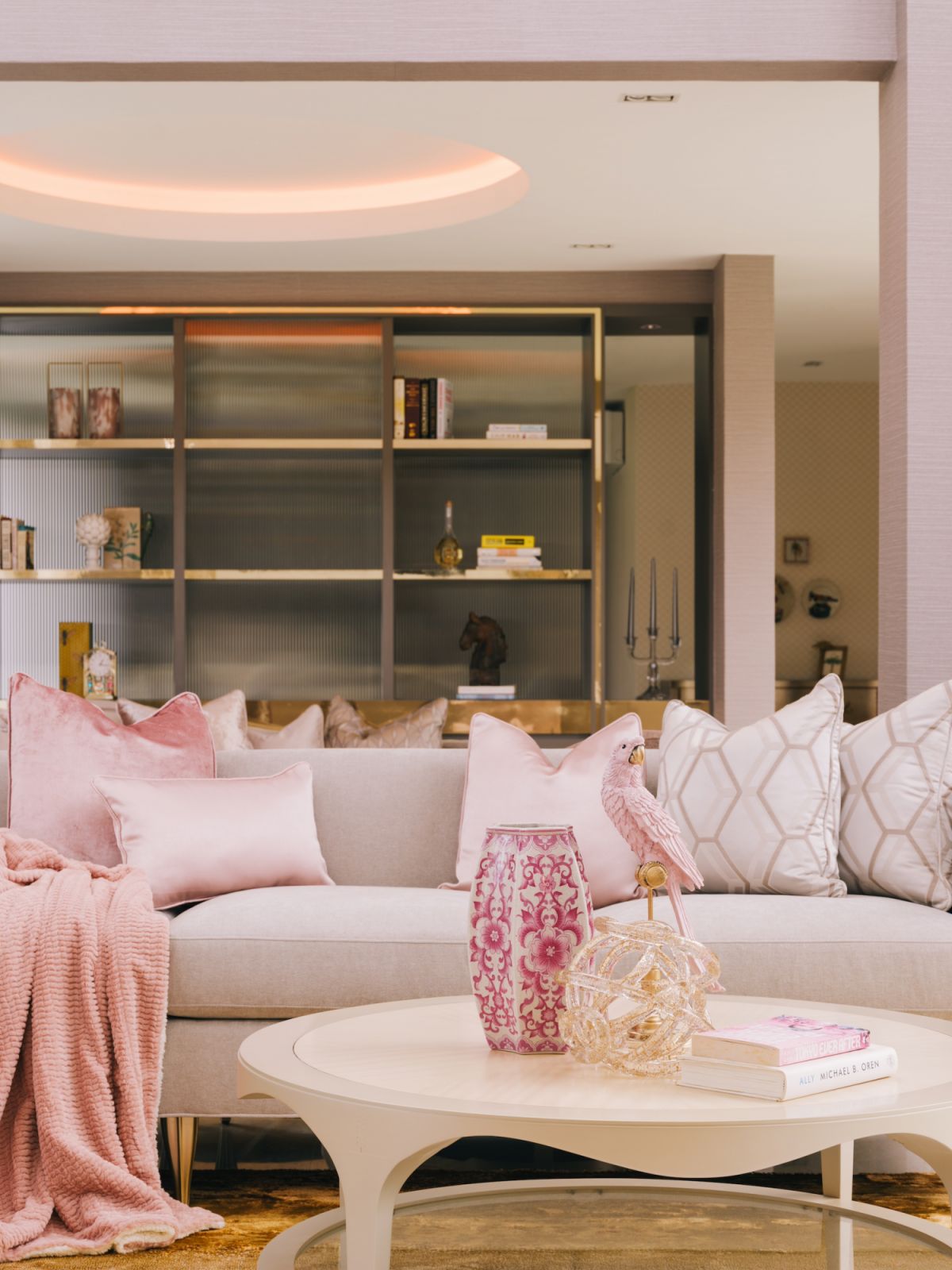 In the bungalow's living room, subtle touches of pink on the soft furnishings and furniture lend sweetness to the overall look (Photo: MarcusL Photography)