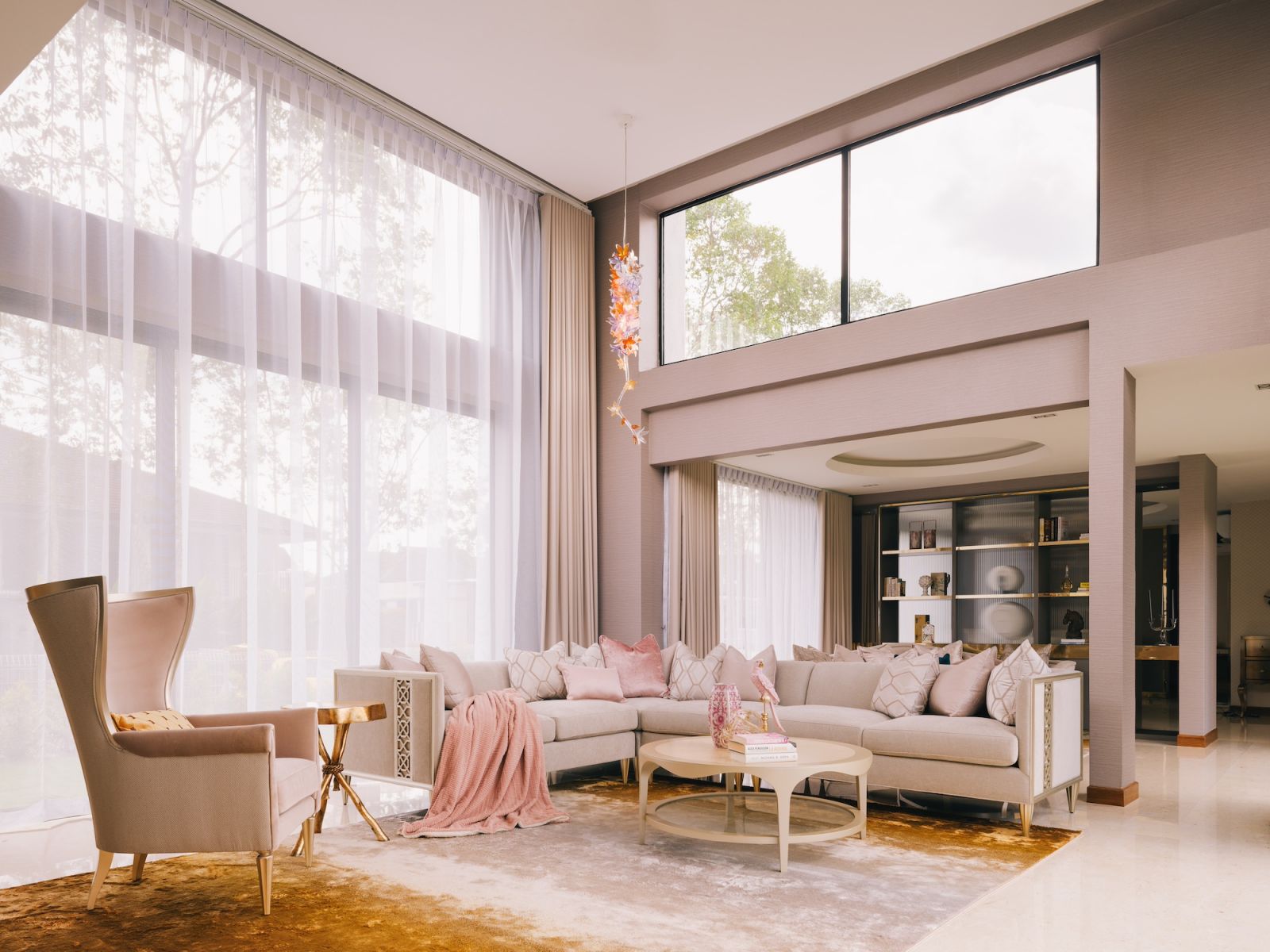 In the bungalow's living room, subtle touches of pink on the soft furnishings and furniture lend sweetness to the overall look (Photo: MarcusL Photography)