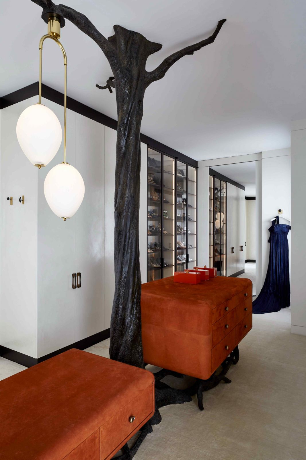 The custom bronze finish tree sculpture encapsulating the riser