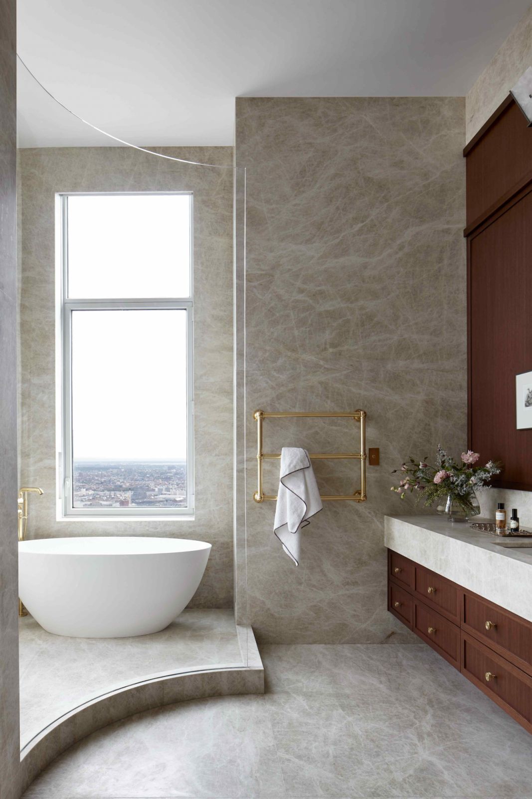 The light-filled primary bath with Taj Mahal quartzite