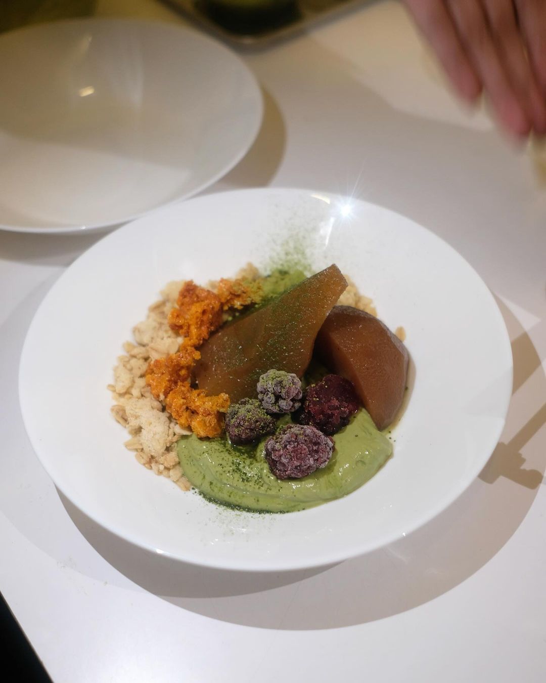Earl grey poached pears, matcha yoghurt, and frozen blackberries (Photo: Instagram / @bonodining)