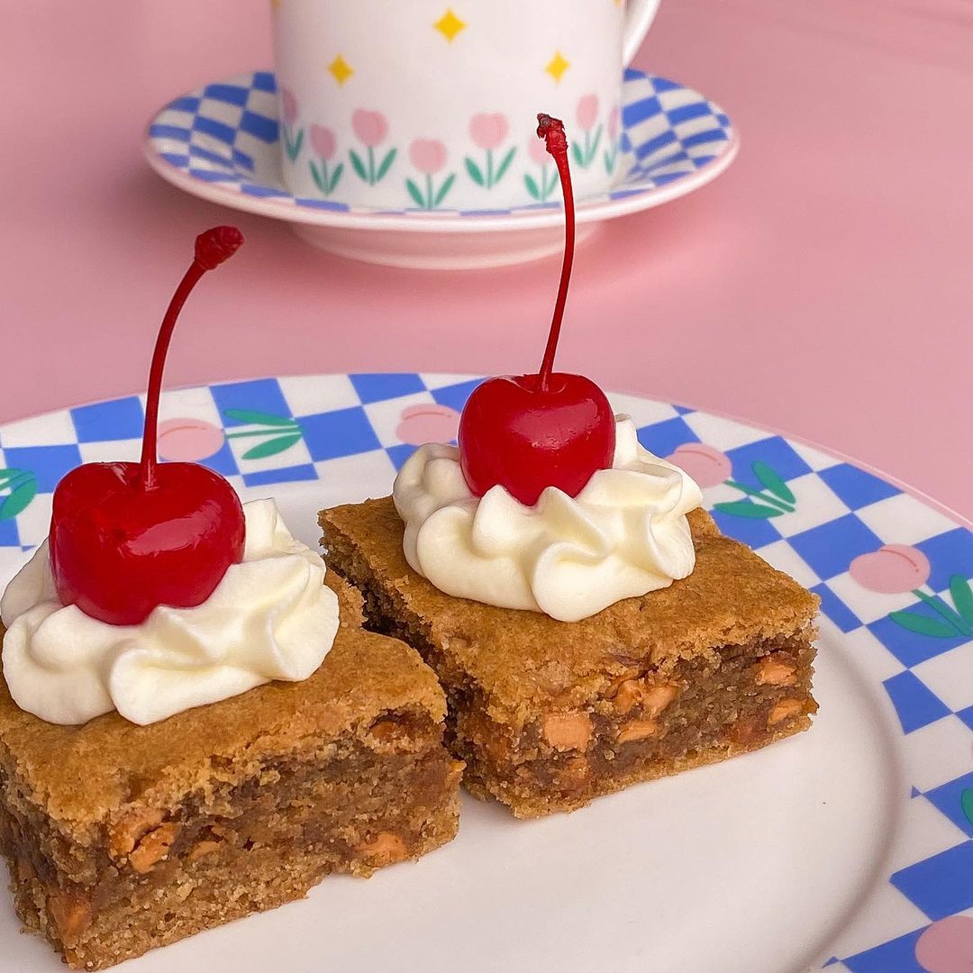 Blondies topped with cherries (Photo: Instagram / @deardairy.bakehouse)