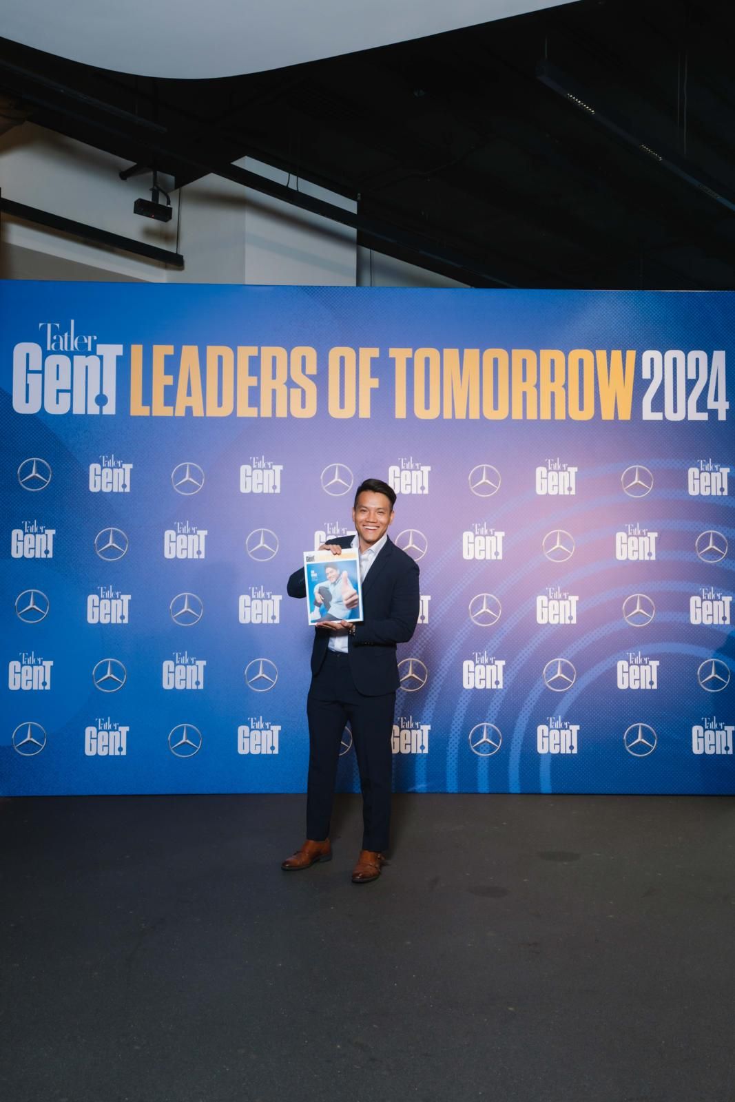 Tatler Gen.T Leaders of Tomorrow 2024 honouree Sho Dewan who founded Workhap poses with his personalised magazine (Photo: Humphrey Ng)