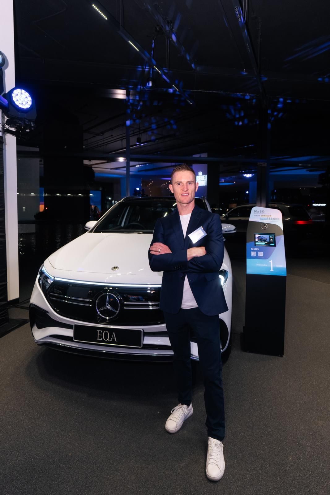 One of Hong Kong top’s jockey Zac Purton posed in front of a Mercedes-Benz vehicle (Photo: Billy Chan)