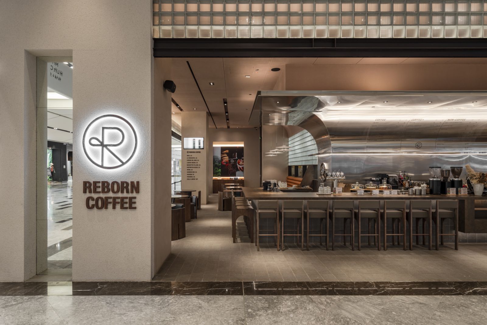 Reborn Coffee, designed by Studio Bikin Architects, fuses bold sophistication with comfort (Photo: David Yeow)