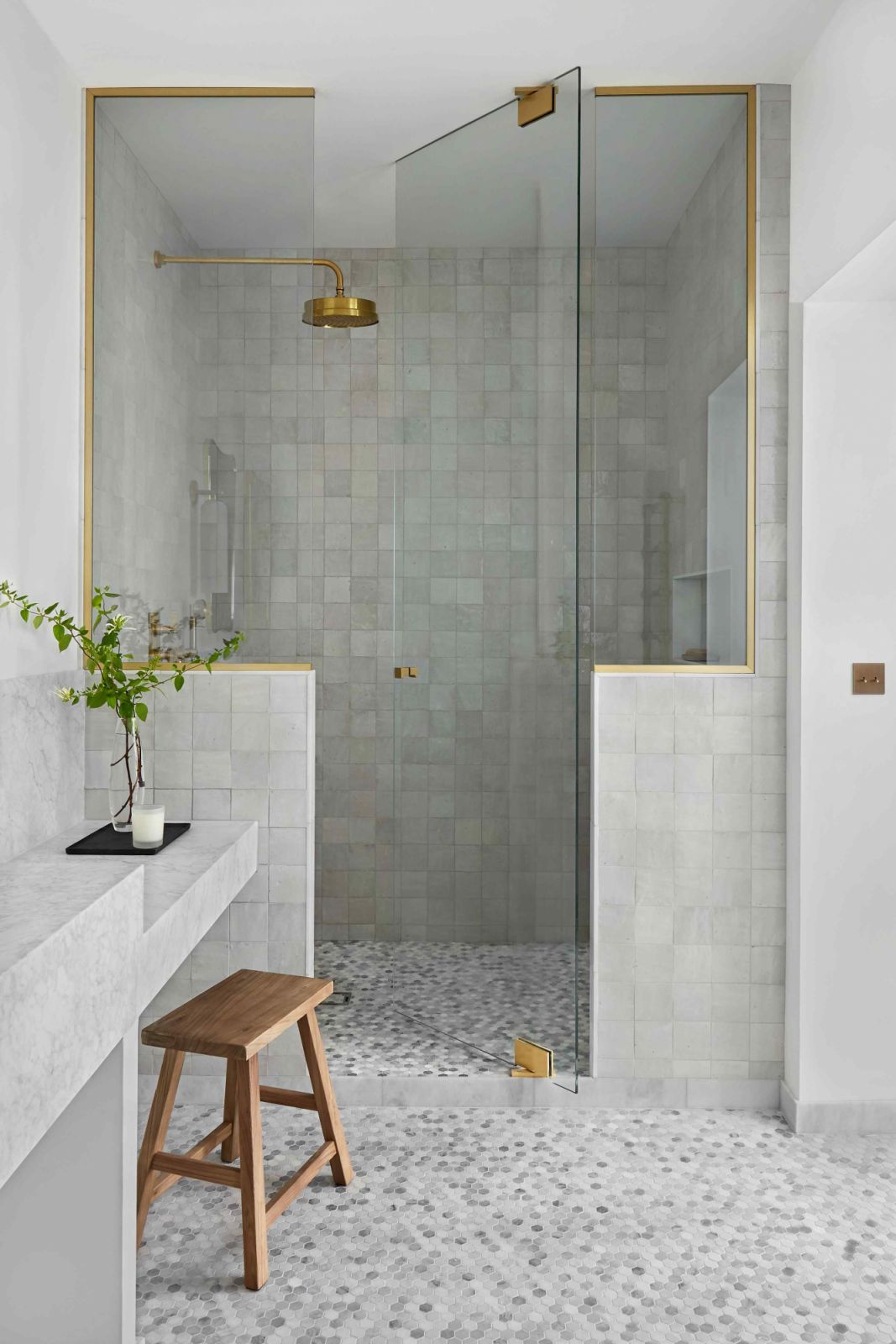 Artisanal zellige and Carrara marble mosaic in the primary bathroom