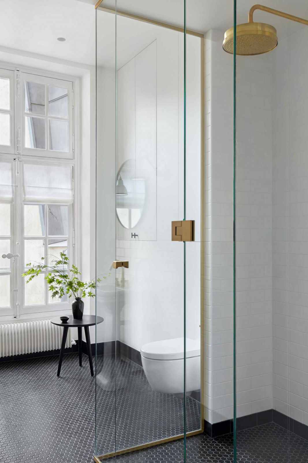 Black marble hexagon tiles in the black and white guest bathroom