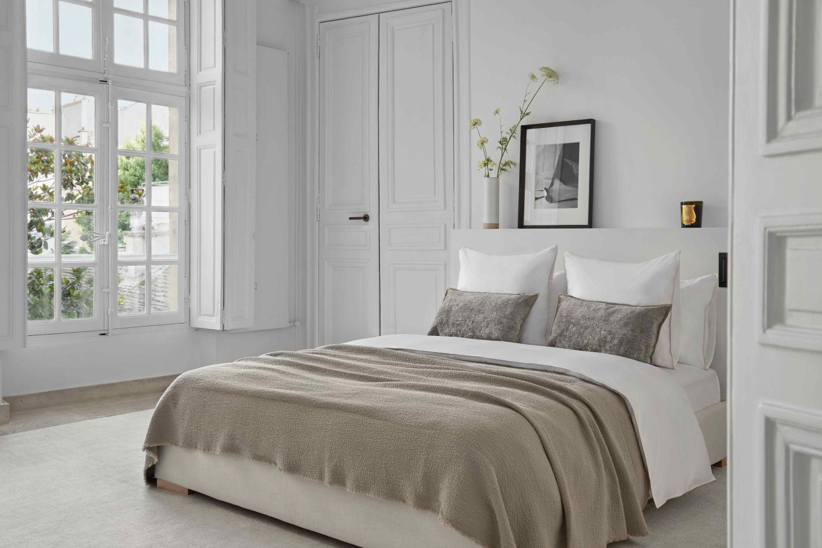 The primary bedroom with beautiful views of the private courtyard