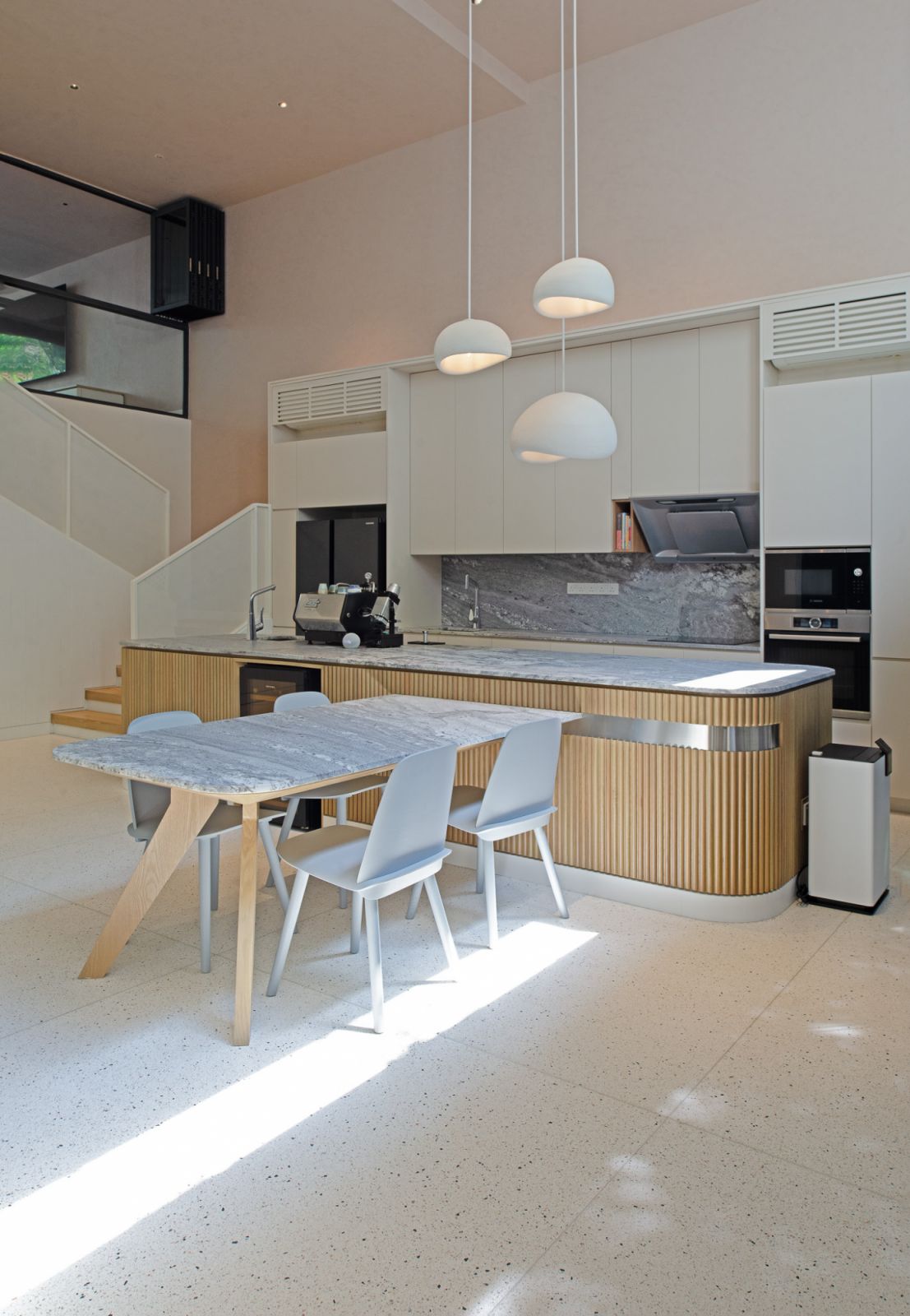 The dry kitchen has a light material palette