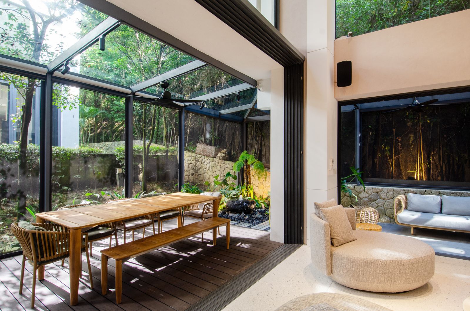 A glass enclosure allows views from the dining area