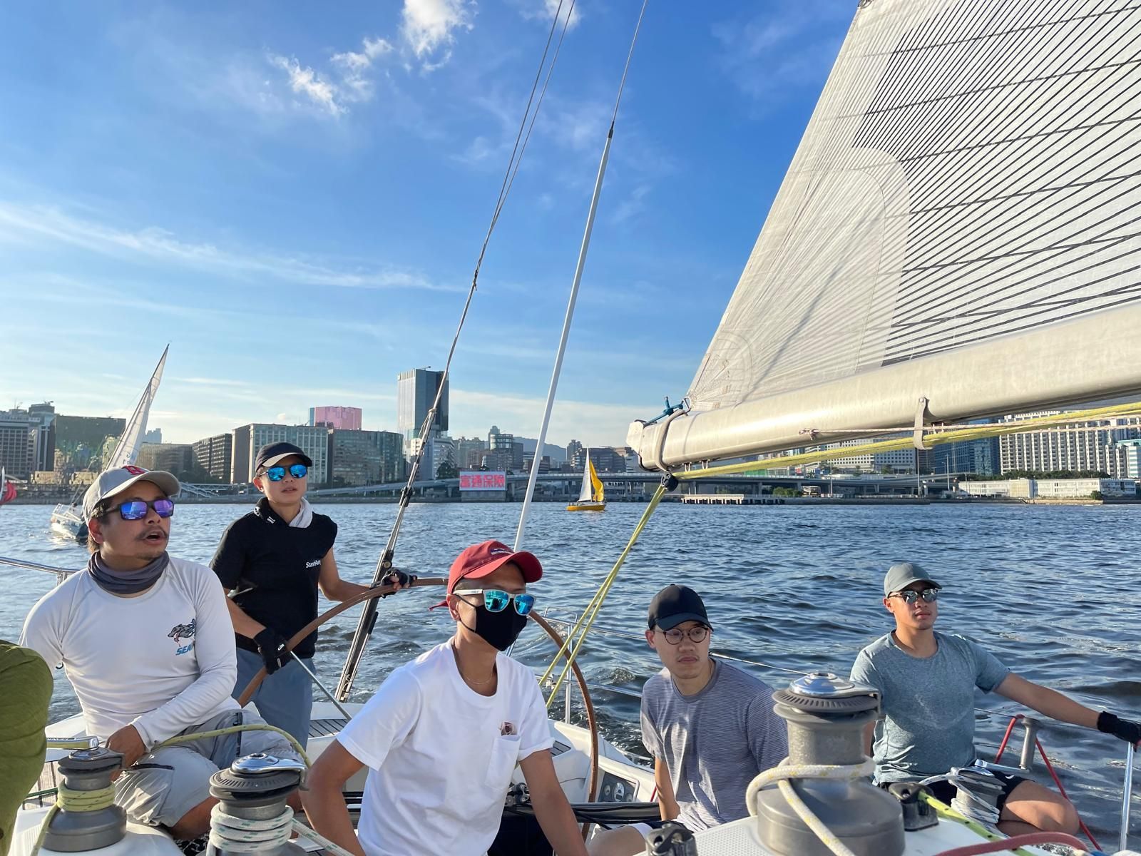 Leung (at the helm) took up sailing during the Covid-19 pandemic