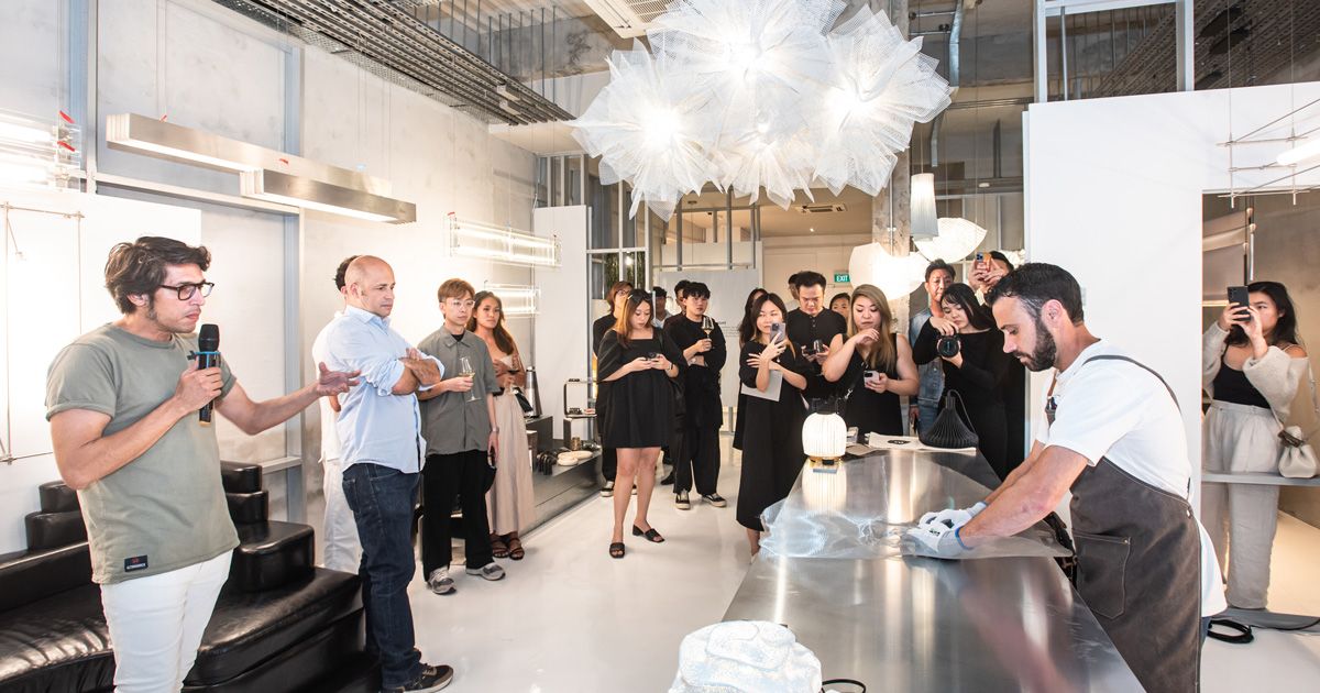 The guests admiring the Spanish craftsmanship infused in each A-Emotional Light luminaire at The Lab 2.1