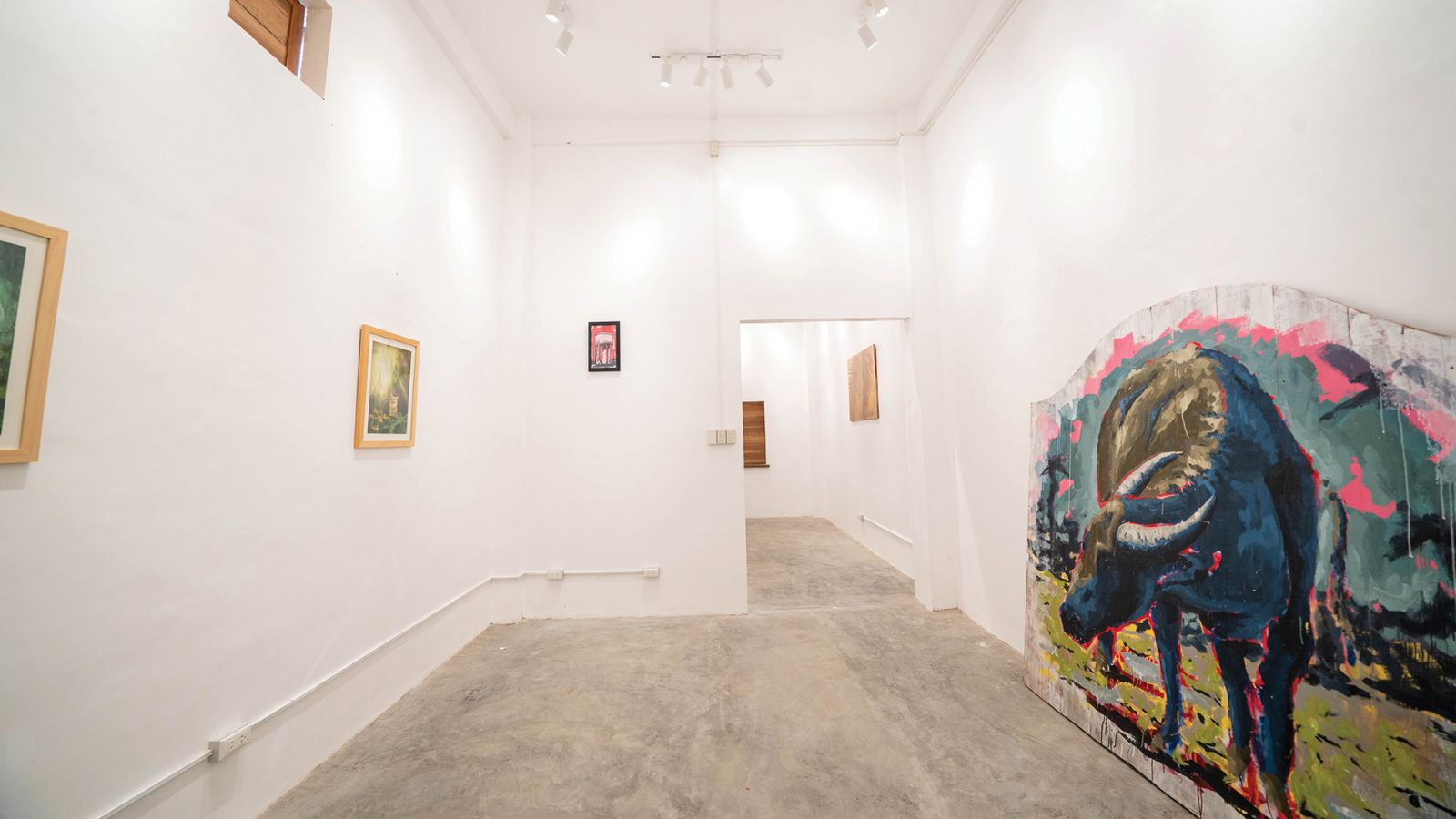 Inside the gallery featuring a carabao painting by Juan Perdiguero Trillo