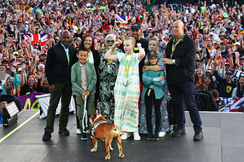 NORTHAMPTON, ENGLAND - JULY 07: Race winner Lewis Hamilton of Great Britain and Mercedes poses for a photo with his family on the fanstage after the F1 Grand Prix of Great Britain at Silverstone Circuit on July 07, 2024 in Northampton, England. (Photo by Peter Fox - Formula 1/Formula 1 via Getty Images)