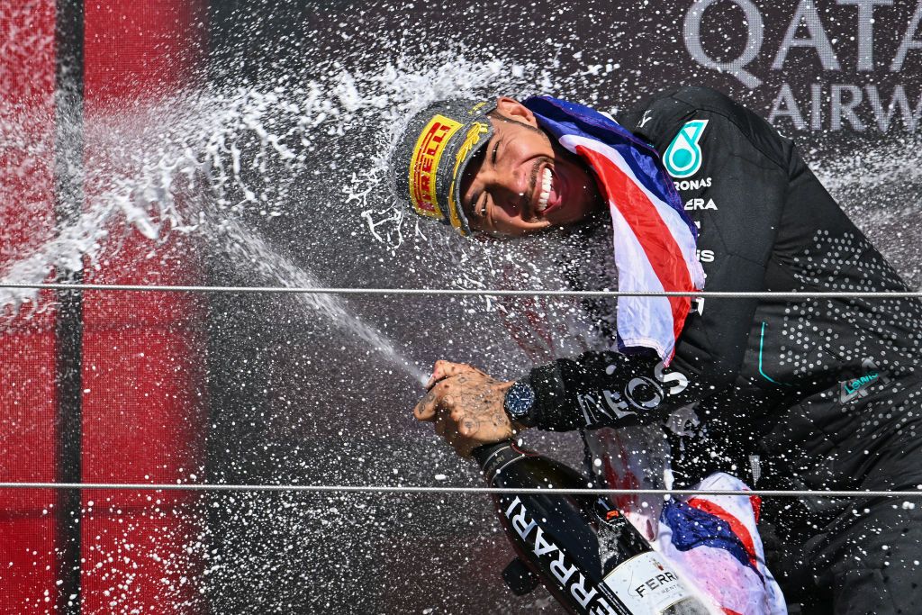 NORTHAMPTON, ENGLAND - JULY 7: Lewis Hamilton of Great Britain and Mercedes-AMG PETRONAS F1 Team celebrates on the podium during the F1 Grand Prix of Great Britain at Silverstone Circuit on July 7, 2024 in Northampton, England.(Photo by Vince Mignott/MB Media/Getty Images)