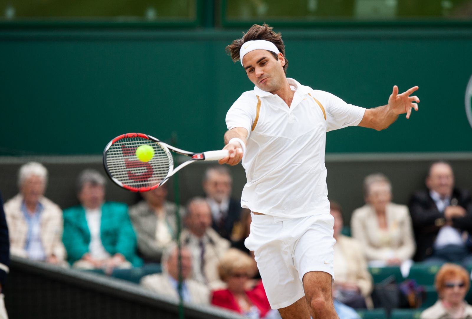 Roger Federer of Switzerland in action during the quarter final Men's Single round against Juan Carlos Ferrero of Spain at The Wimbledon Lawn Tennis Championship at the All England Lawn and Tennis Club at Wimbledon (Photo: Simon M Bruty/GettyImages)